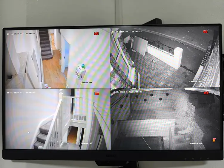 4-channel CCTV monitoring screen showing home security cameras installed in Lambeth, South London
