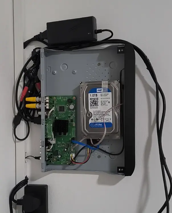 DVR recorder with WD Blue 1TB hard drive installed on wall at residential property in Lambeth, South London
