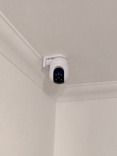 Smart PTZ security camera mounted on a ceiling in a London commercial office by CCTVcam