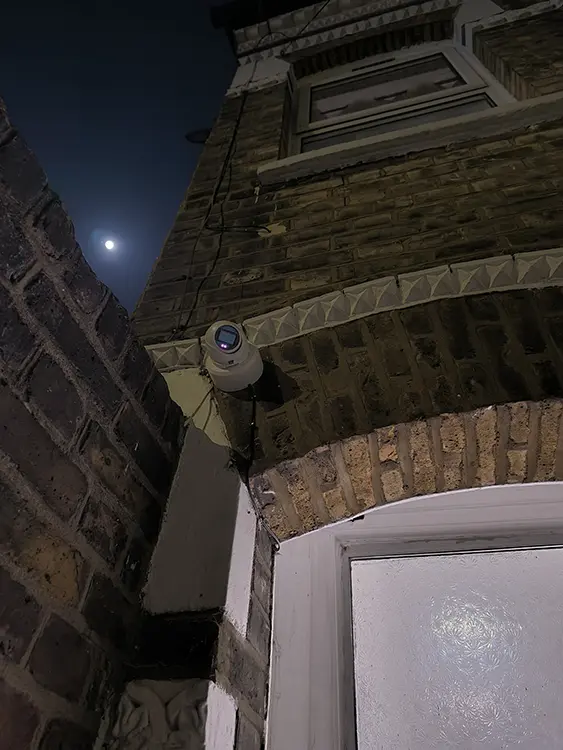 Outdoor CCTV camera installed above front door entrance of residential property in Lambeth, South London