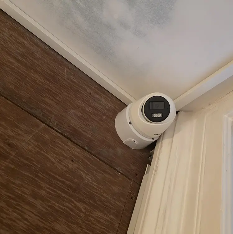 CCTV bullet camera installed in corner of commercial interior in Twickenham TW1