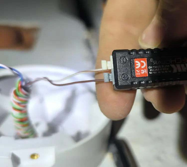 CCTV video balun connector being wired during home camera installation in Earlsfield SW18