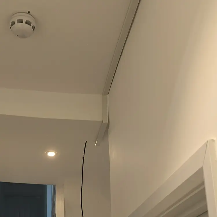 CCTV cable trunking neatly installed along ceiling corner at residential property in Whitton TW2, Richmond — professional installation by cctvcam.co.uk