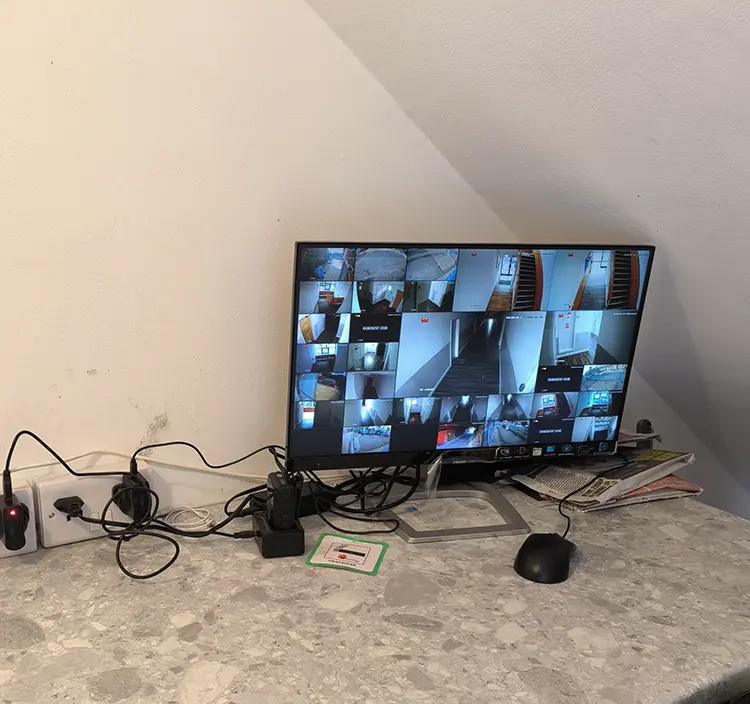 CCTV monitor displaying multiple camera feeds after installation in Surbiton KT6