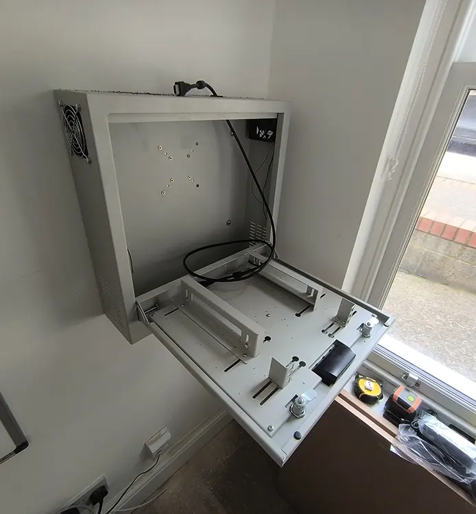 Commercial CCTV DVR cabinet being installed on wall at business premises in Dulwich SE22