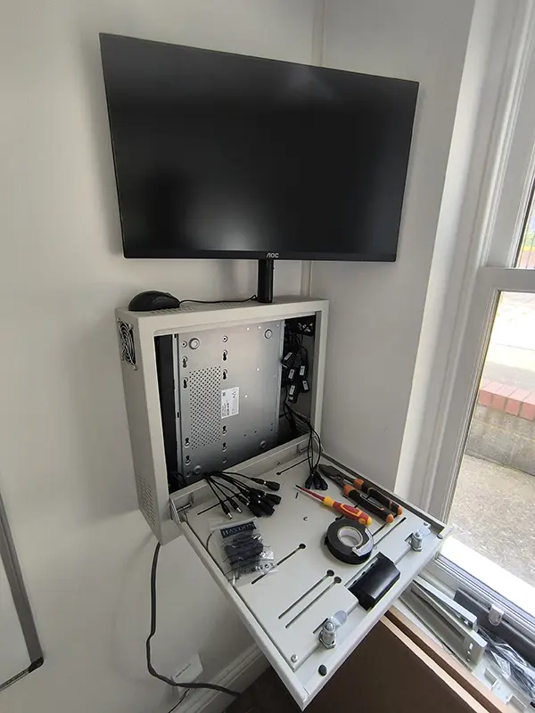 Commercial CCTV DVR cabinet with AOC monitor being set up at business premises in Dulwich SE22