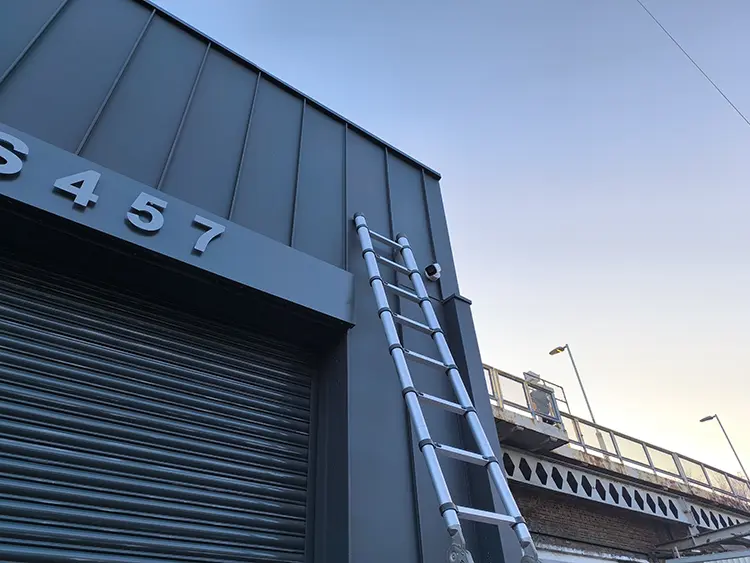 Exterior CCTV camera installed high on commercial building facade in West Norwood SE27