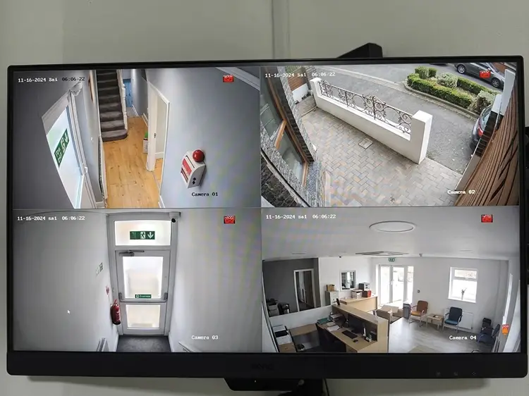CCTV monitor showing 4-camera live view at commercial premises in Clapham Junction SW11 — indoor and outdoor coverage by cctvcam.co.uk