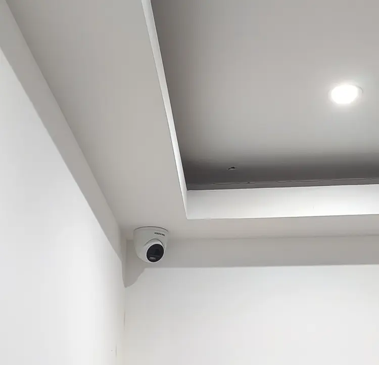Discreet CCTV camera installed in ceiling corner in Wimbledon SW19