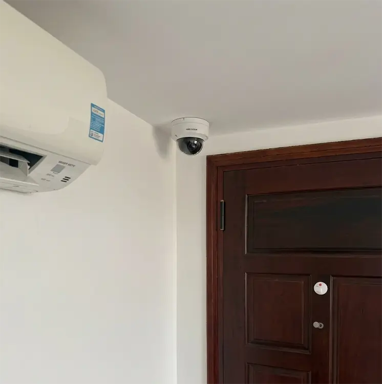 Dome CCTV camera installed above entrance door in home in Cheam SM3