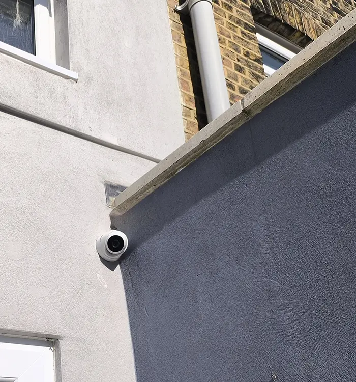 Exterior CCTV camera mounted on brick wall of residential property in Battersea SW11 — outdoor security installation by CCTVcam
