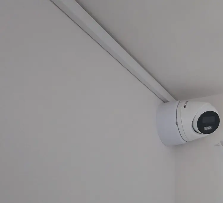 Hikvision 5MP dome camera installed in corner of residential property in Croydon