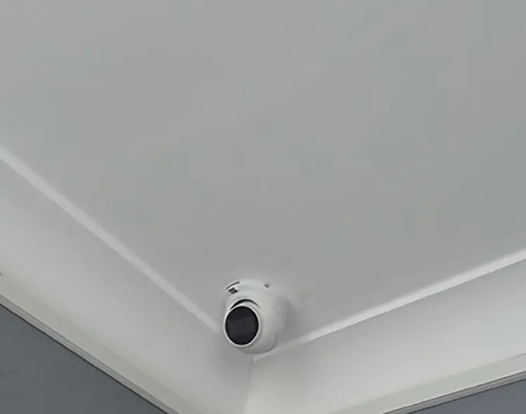 Hikvision dome CCTV camera installed in ceiling corner of residential property in Earlsfield SW18