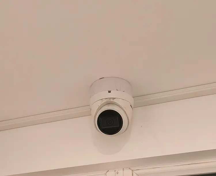 Hikvision dome CCTV camera installed on hallway ceiling at residential property in Surbiton KT6