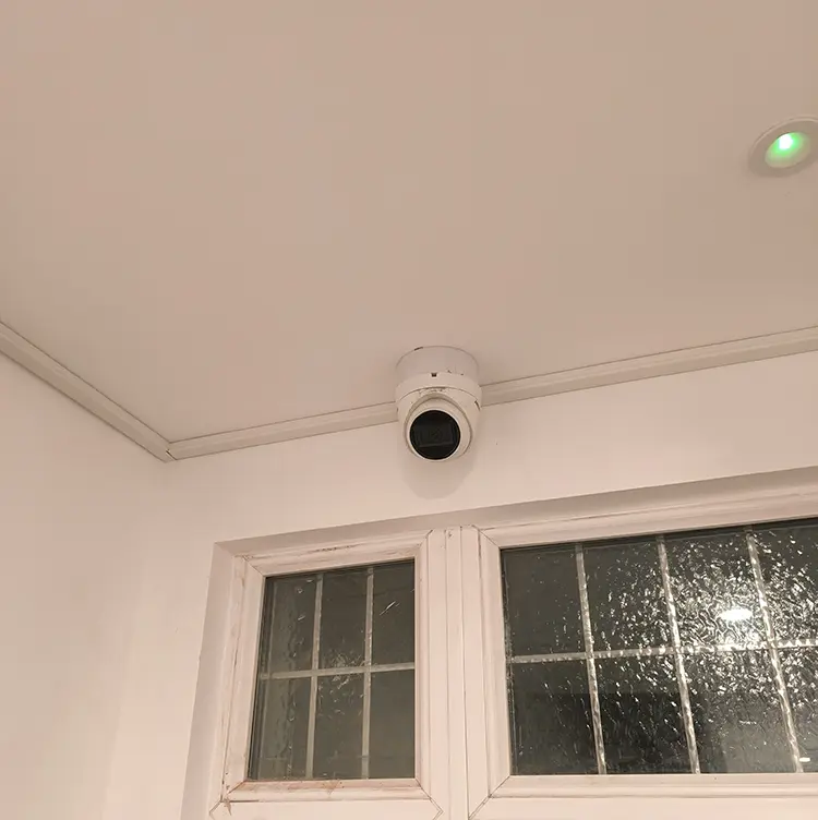 Hikvision dome CCTV camera installed on hallway ceiling above front door in Wallington SM6, London Borough of Sutton