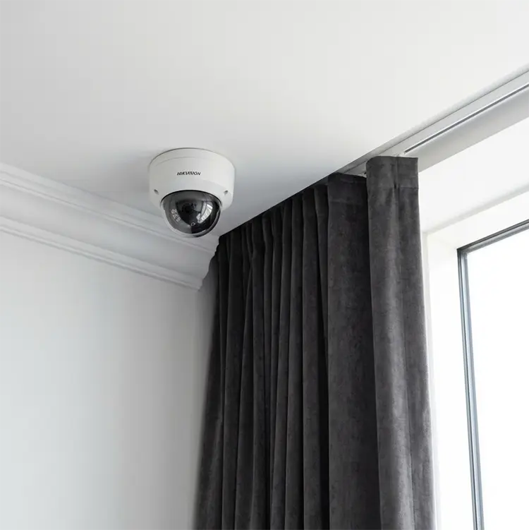 Hikvision dome CCTV camera installed in corner of ceiling in home in Cheam SM3