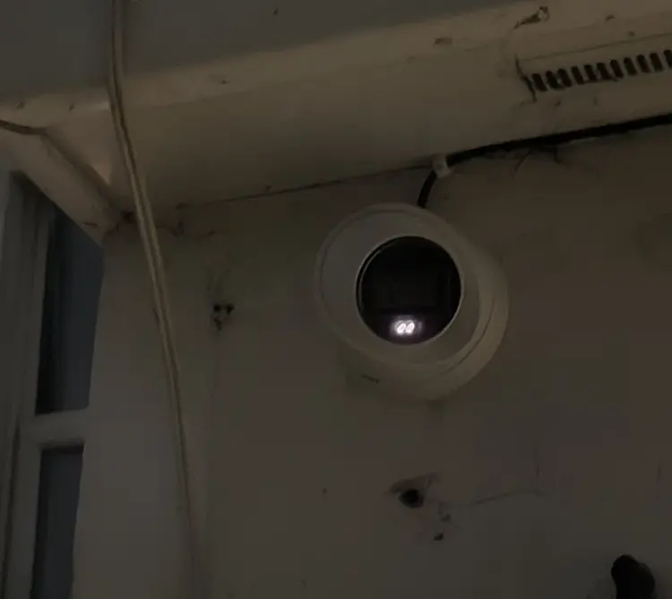 Outdoor dome CCTV camera with night vision installed above front door in Earlsfield SW18