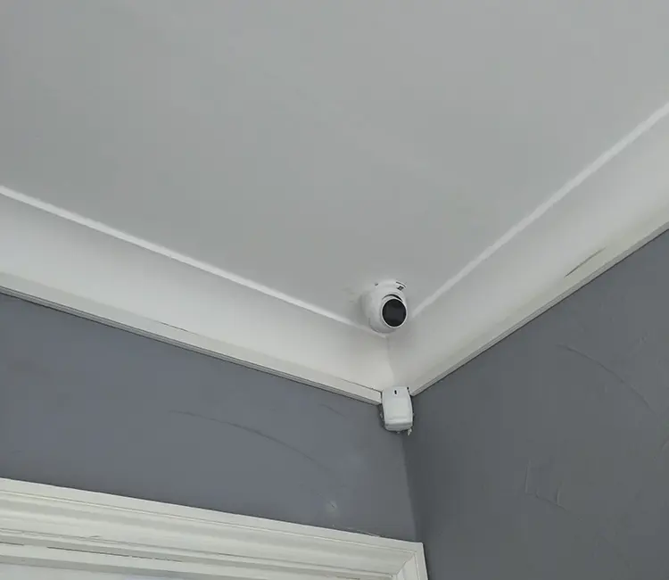 Indoor CCTV dome camera installed in corner of residential hallway in Croydon