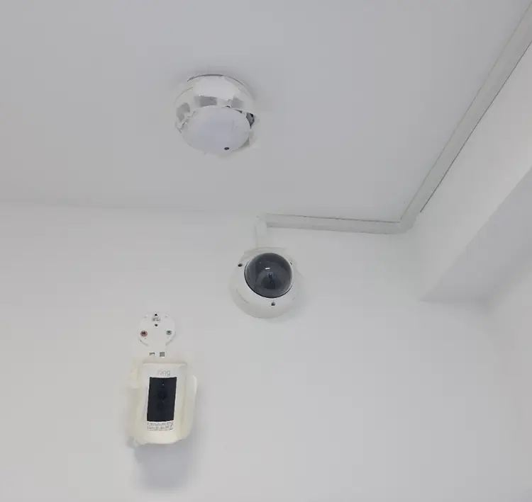 Indoor dome CCTV camera and security devices installed on ceiling at commercial premises in Clapham Junction SW11 — professional installation by cctvcam.co.uk