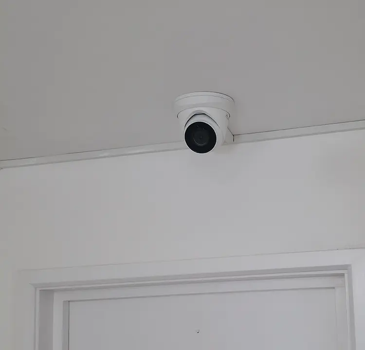 Indoor dome CCTV camera installed above door at residential property in Whitton TW2, Richmond — home security by cctvcam.co.uk