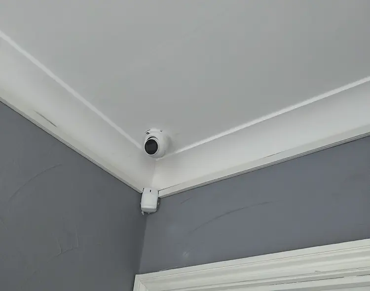 Indoor dome CCTV camera installed in ceiling corner of residential property in Tooting SW17 South London