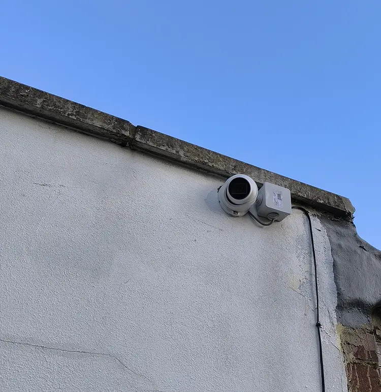 Outdoor dome CCTV security camera mounted on exterior wall of residential property in Tooting SW17 South London
