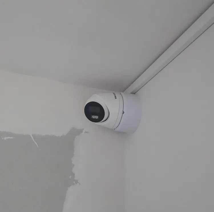 Wireless PTZ CCTV camera installed in ceiling corner of residential property in Furzedown SW17