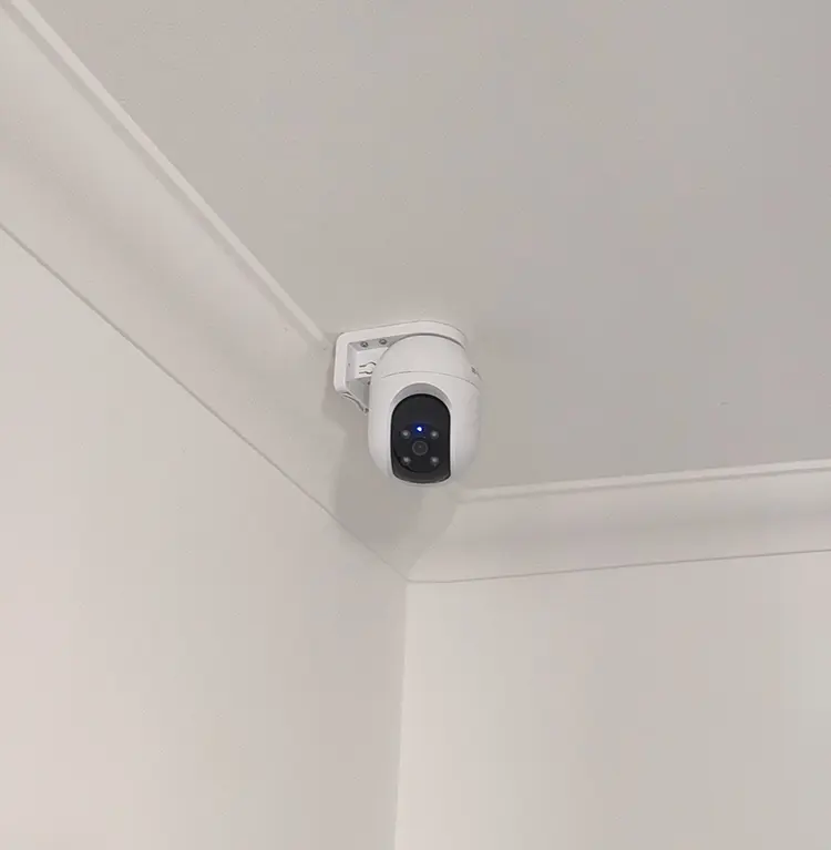 Wireless PTZ security camera installed in ceiling corner of residential property in Dulwich SE22