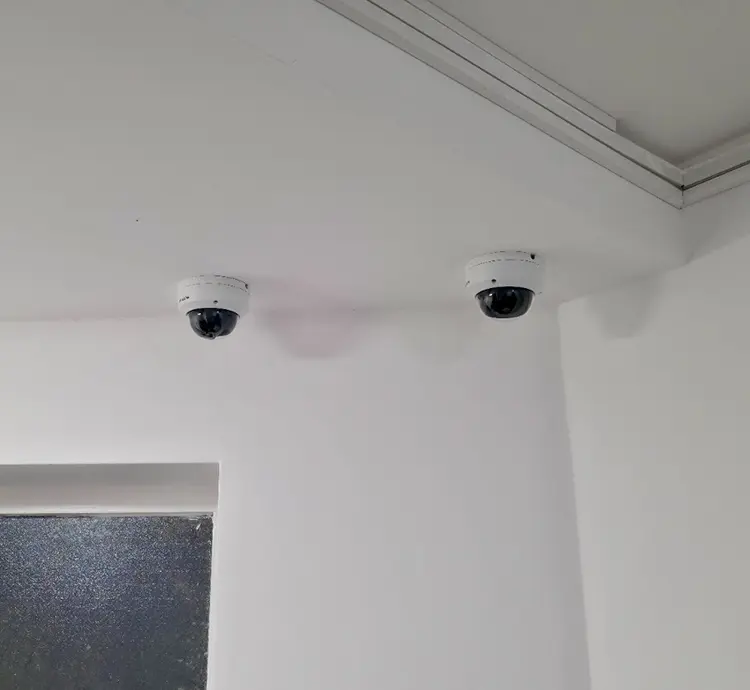 Two dome CCTV cameras installed on ceiling at commercial premises in Clapham Junction SW11 — professional business security by cctvcam.co.uk